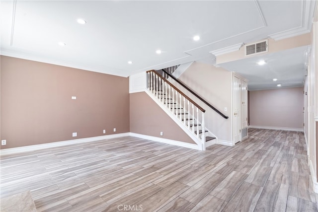 interior space featuring ornamental molding and light hardwood / wood-style flooring