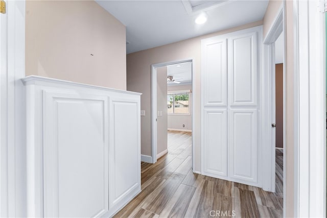 hallway with light wood-type flooring