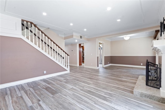 entrance foyer featuring light hardwood / wood-style floors and crown molding