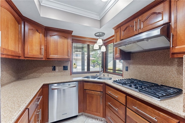 kitchen with appliances with stainless steel finishes, light stone counters, tasteful backsplash, ornamental molding, and sink