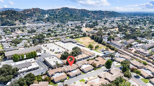 birds eye view of property with a mountain view