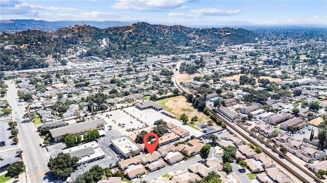 birds eye view of property featuring a mountain view