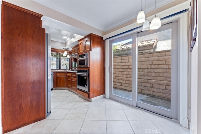 kitchen with decorative light fixtures, a wealth of natural light, ornamental molding, and stainless steel oven