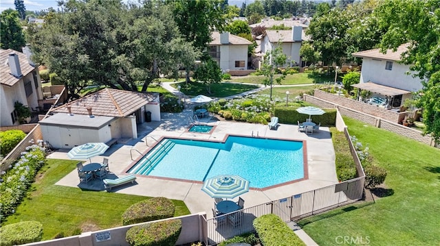 view of swimming pool with a lawn and a patio area