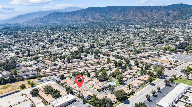 birds eye view of property with a mountain view