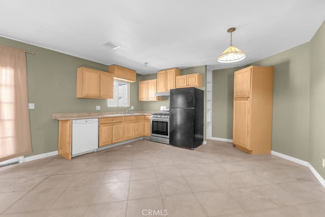 kitchen featuring pendant lighting, dishwasher, stainless steel gas stove, light brown cabinets, and black refrigerator