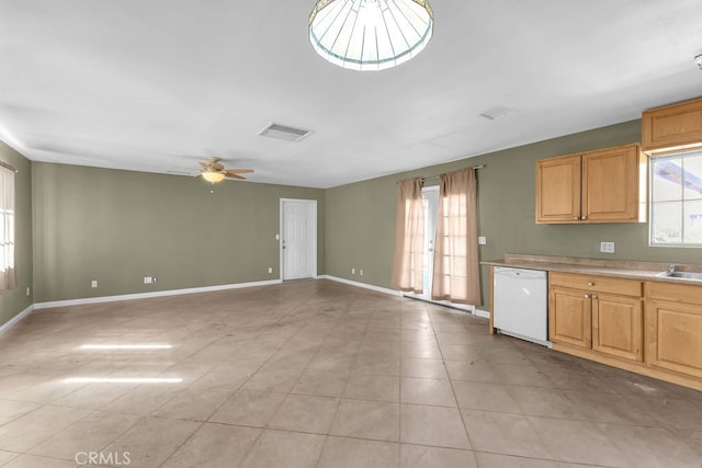 kitchen featuring white dishwasher, ceiling fan, and light tile patterned floors