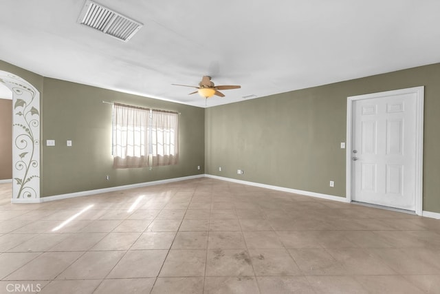 unfurnished room with ceiling fan and light tile patterned floors