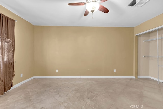 unfurnished bedroom featuring ceiling fan and a closet