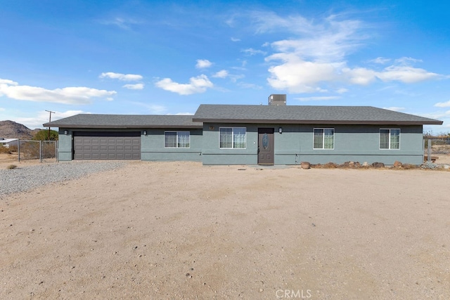 ranch-style home with a garage