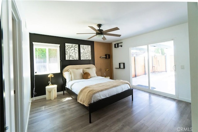 bedroom featuring access to outside, ceiling fan, and wood-type flooring