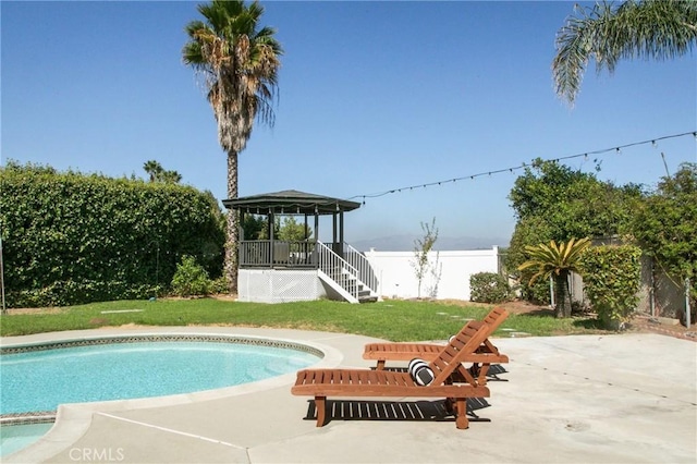 view of pool featuring a gazebo, a lawn, and a patio