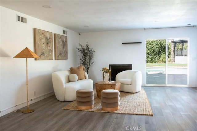 sitting room with hardwood / wood-style floors