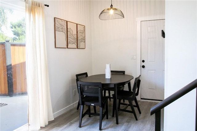 dining room with hardwood / wood-style flooring