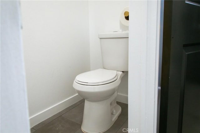 bathroom featuring tile patterned floors and toilet