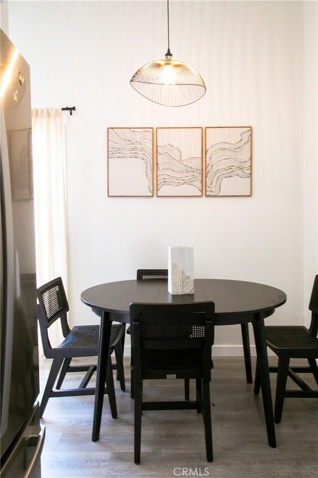 dining room with hardwood / wood-style floors