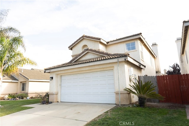 view of front of property with a garage and a front lawn