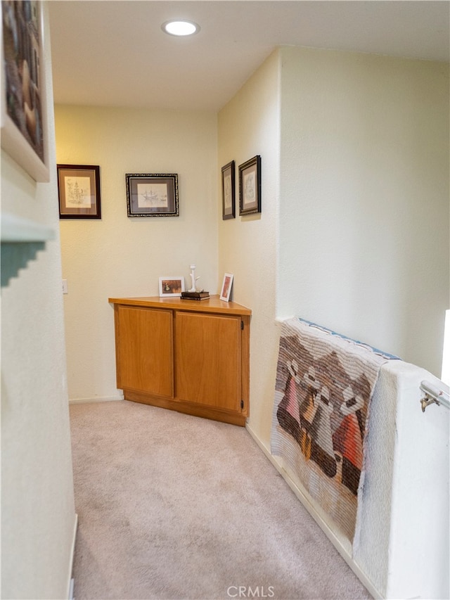 corridor with light carpet