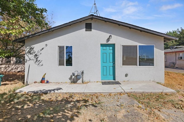 back of property featuring a patio