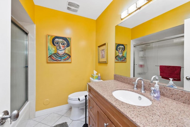 full bathroom featuring tile patterned floors, vanity, toilet, and shower / bath combination with glass door