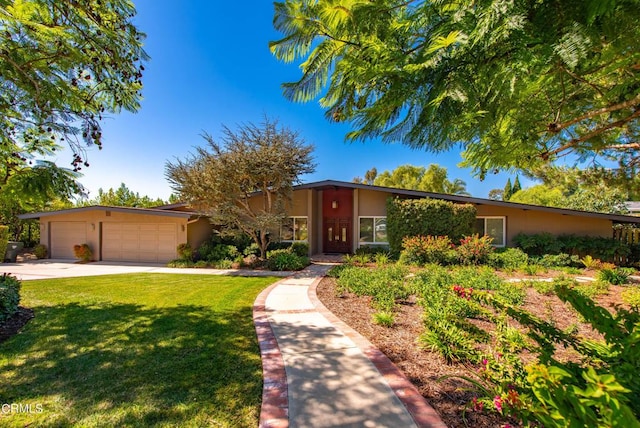 ranch-style house featuring a garage and a front lawn