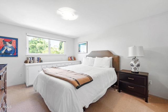 bedroom with light carpet