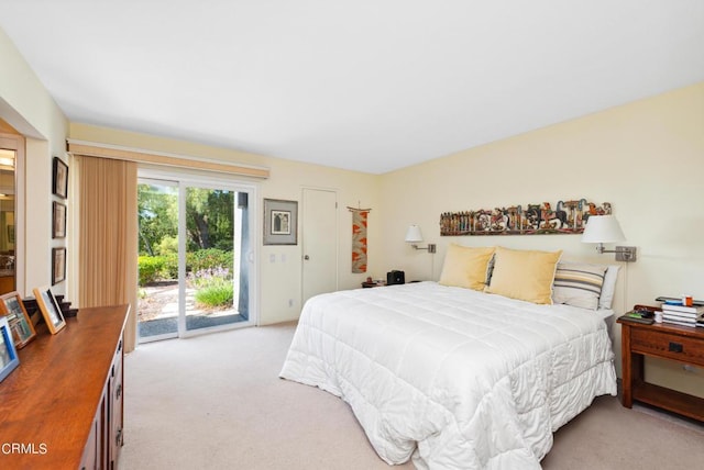 carpeted bedroom featuring access to exterior