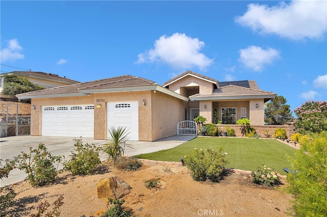 view of front of home with a garage and a front yard