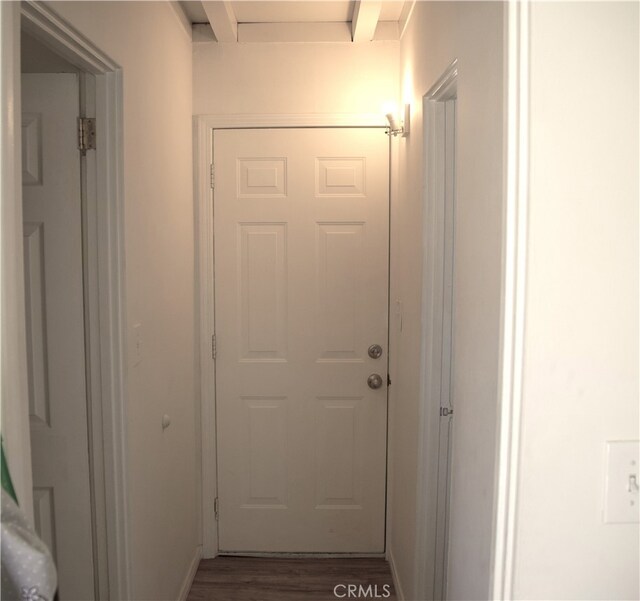 corridor featuring dark wood-type flooring