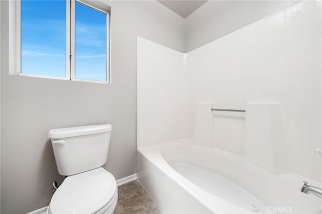 bathroom featuring toilet, shower / bath combination, and tile patterned floors