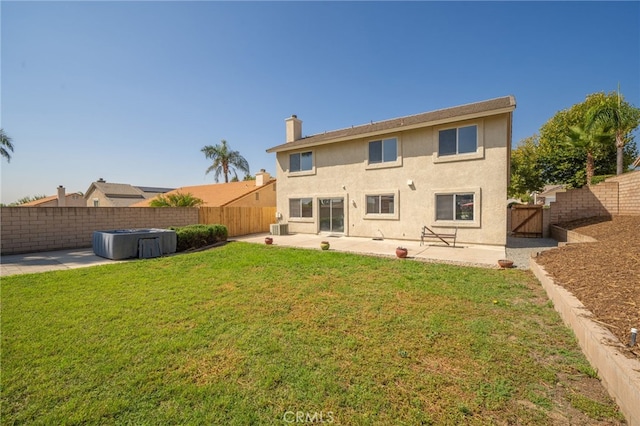 back of property featuring cooling unit, a yard, and a patio