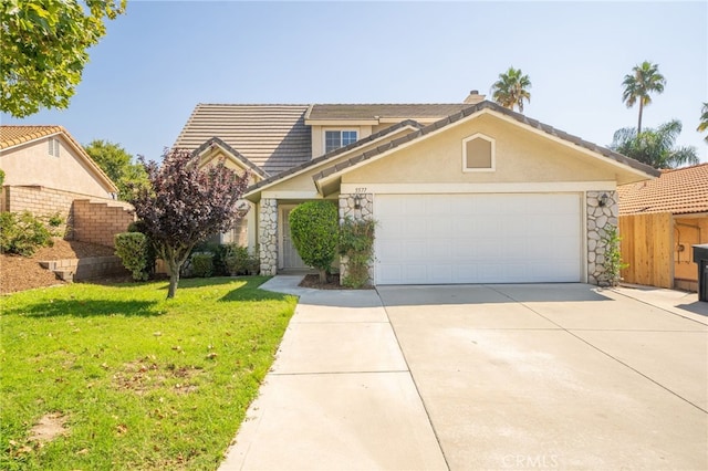 view of front facade with a garage and a front lawn