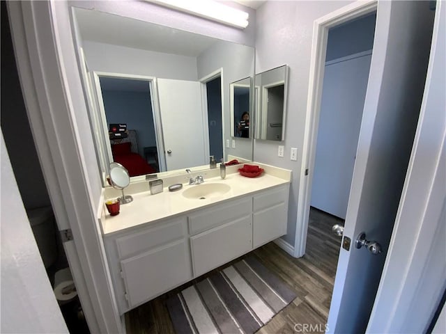 bathroom featuring wood-type flooring and vanity