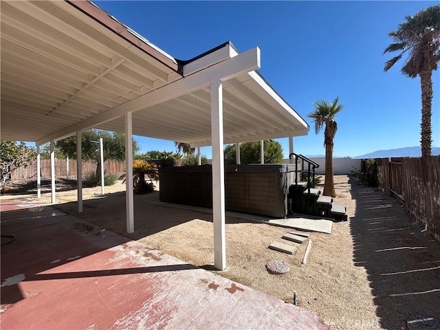 view of patio with a hot tub