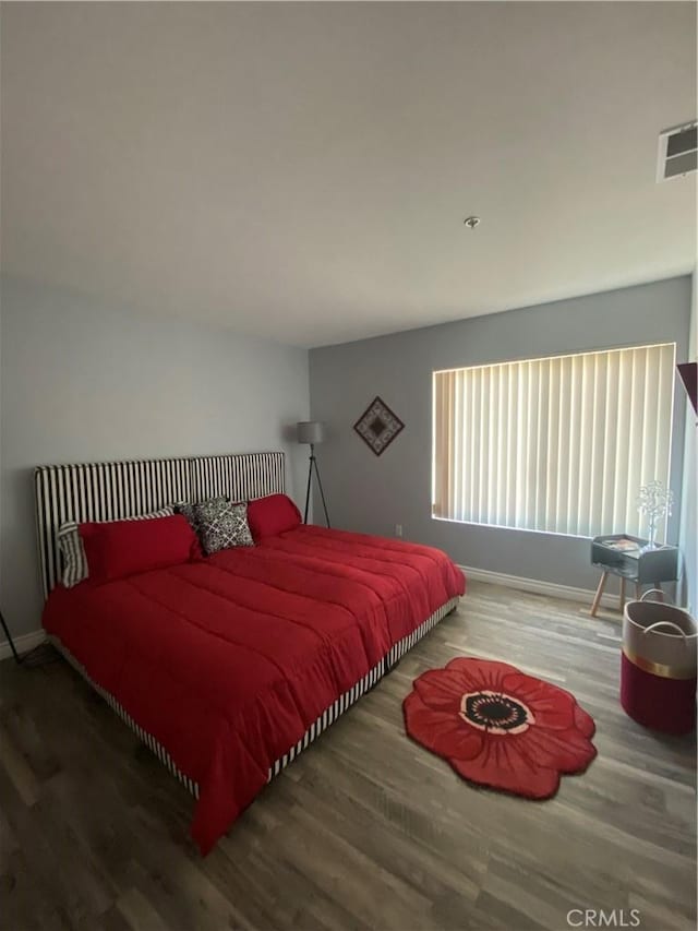 bedroom with wood-type flooring