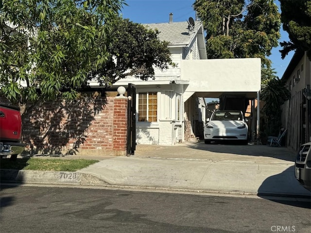 view of front facade with a carport