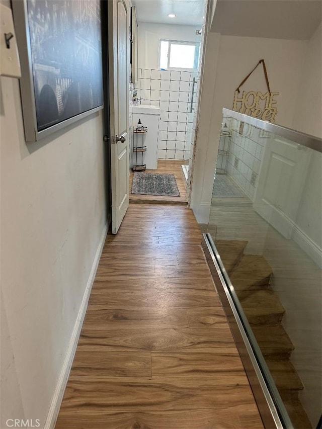 hallway with wood-type flooring