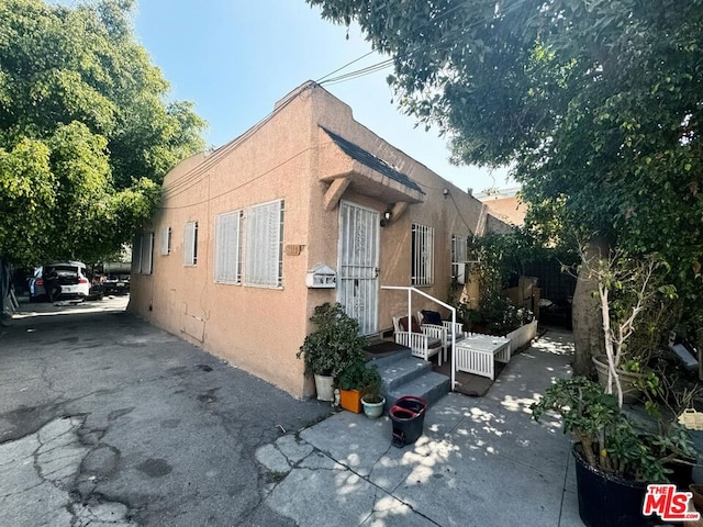 view of side of home featuring a patio area