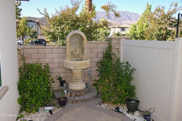 view of gate with a mountain view