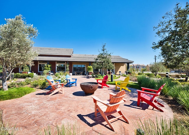 view of patio with a fire pit