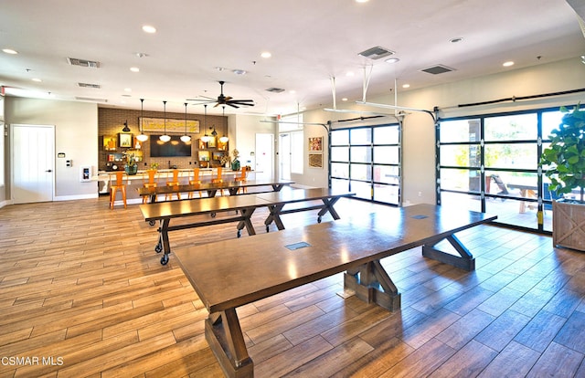 dining room featuring light hardwood / wood-style flooring and ceiling fan