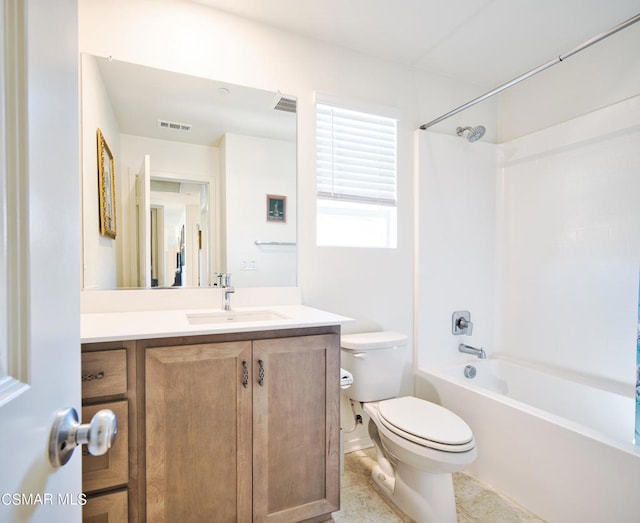 full bathroom featuring vanity, bathtub / shower combination, and toilet