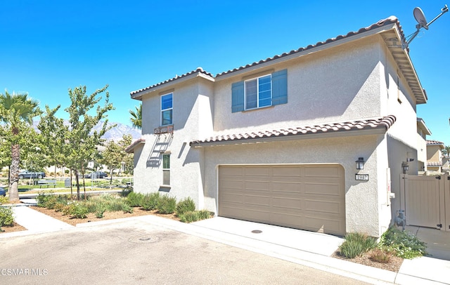 mediterranean / spanish house featuring a garage