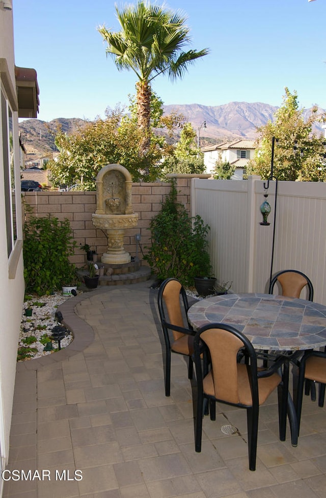 view of patio / terrace with a mountain view