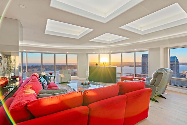 sunroom / solarium with a water view and plenty of natural light