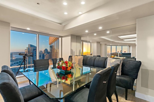 dining space featuring hardwood / wood-style flooring and plenty of natural light