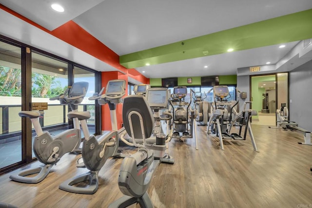 exercise room featuring light hardwood / wood-style floors