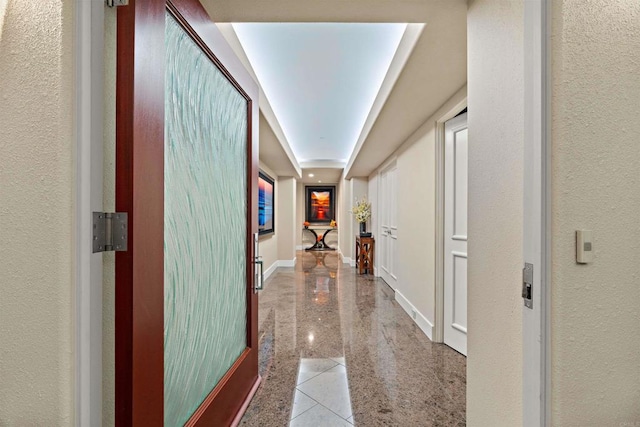 hallway with light tile patterned floors