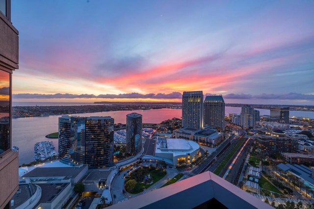 aerial view at dusk with a water view