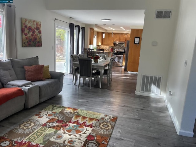 living room featuring dark hardwood / wood-style flooring